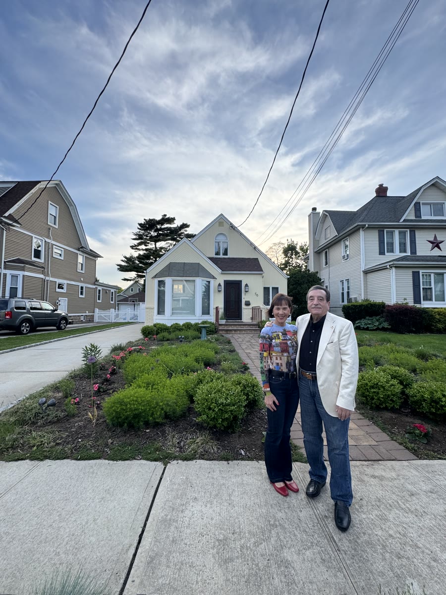 Joe’s parents together outside a family home