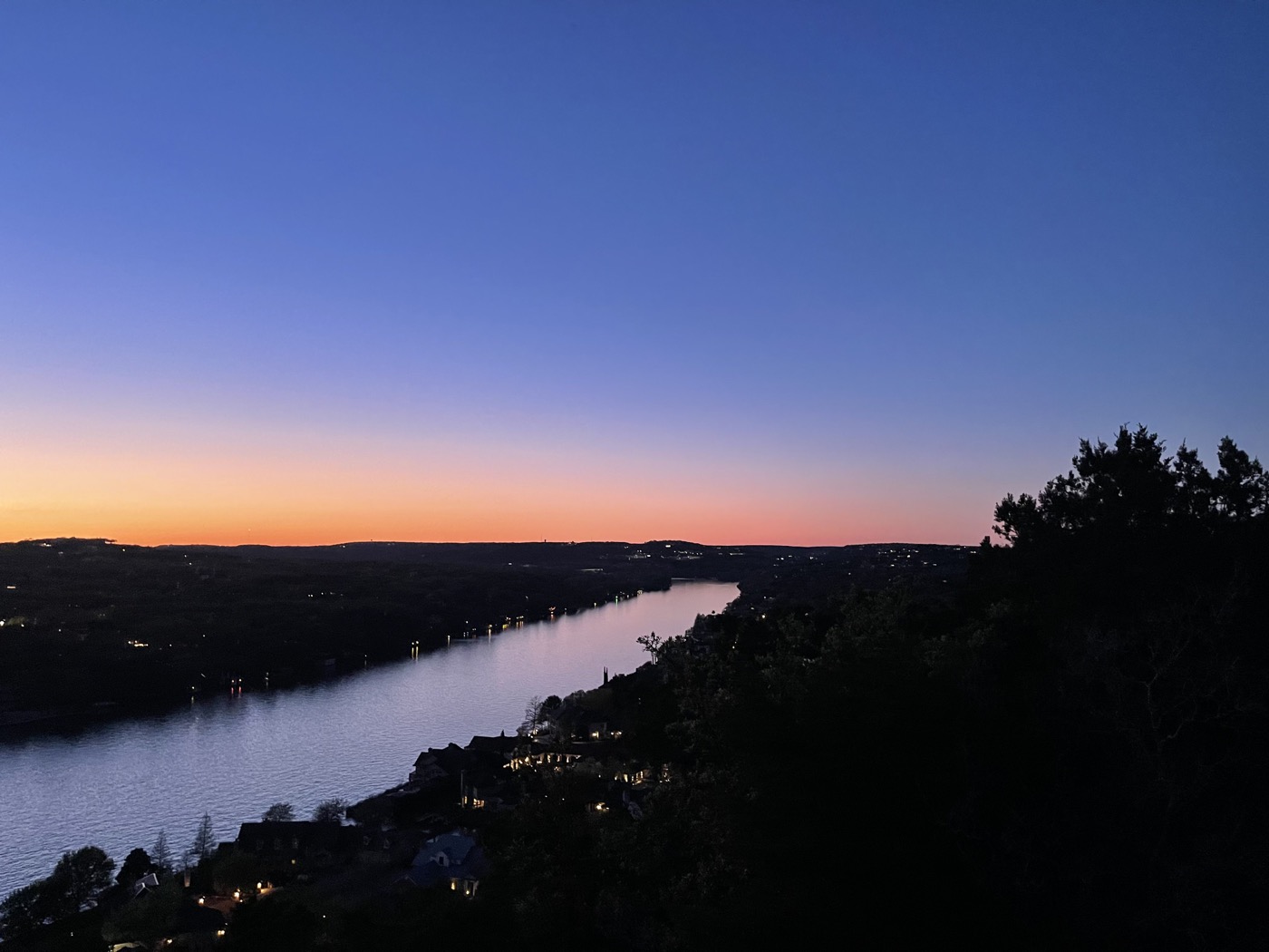 Sunset over the water and Austin hills